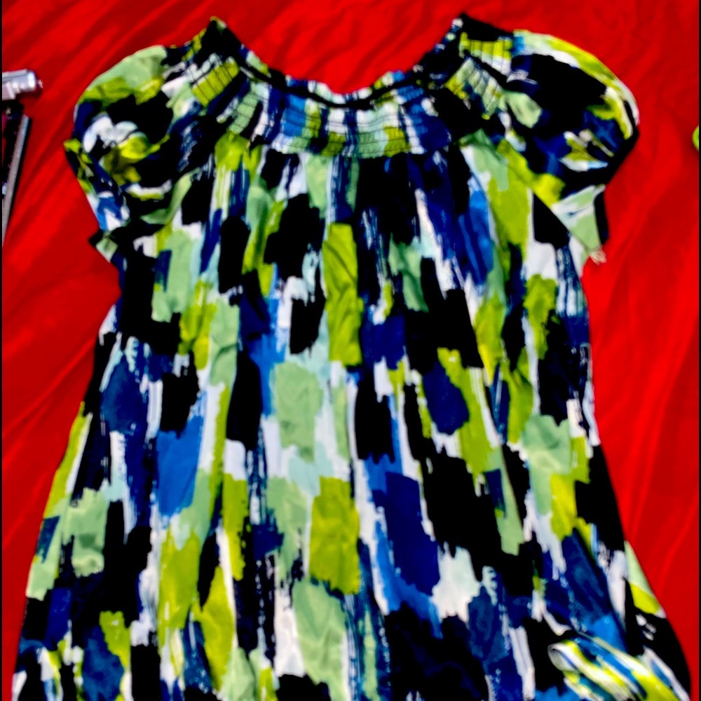 This is a blue, green, and white dress shirt that ties on the left side